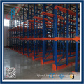 Narrow aisle rack with floor rail for cold house storage